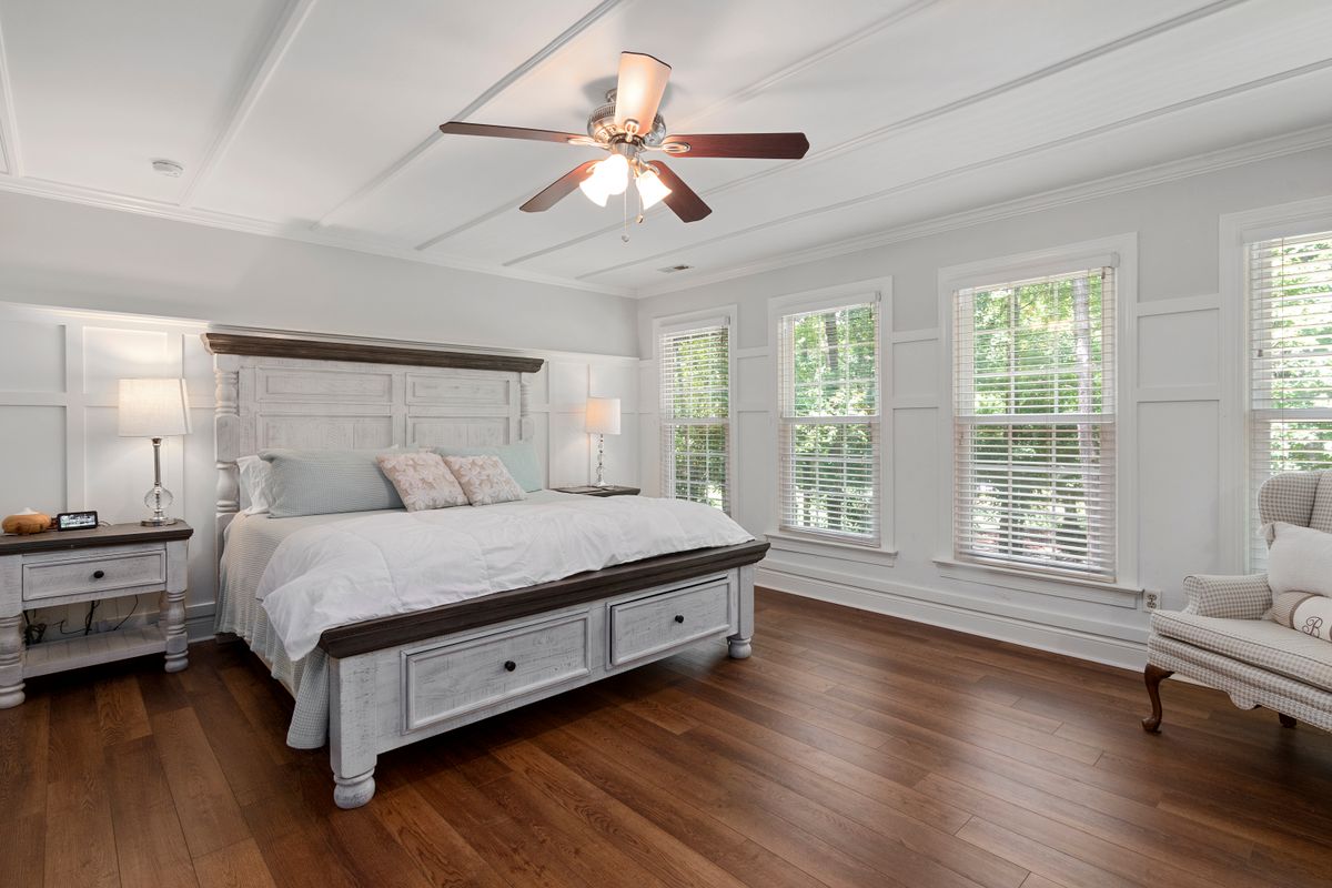 Bright bedroom with freshly painted white walls and trim